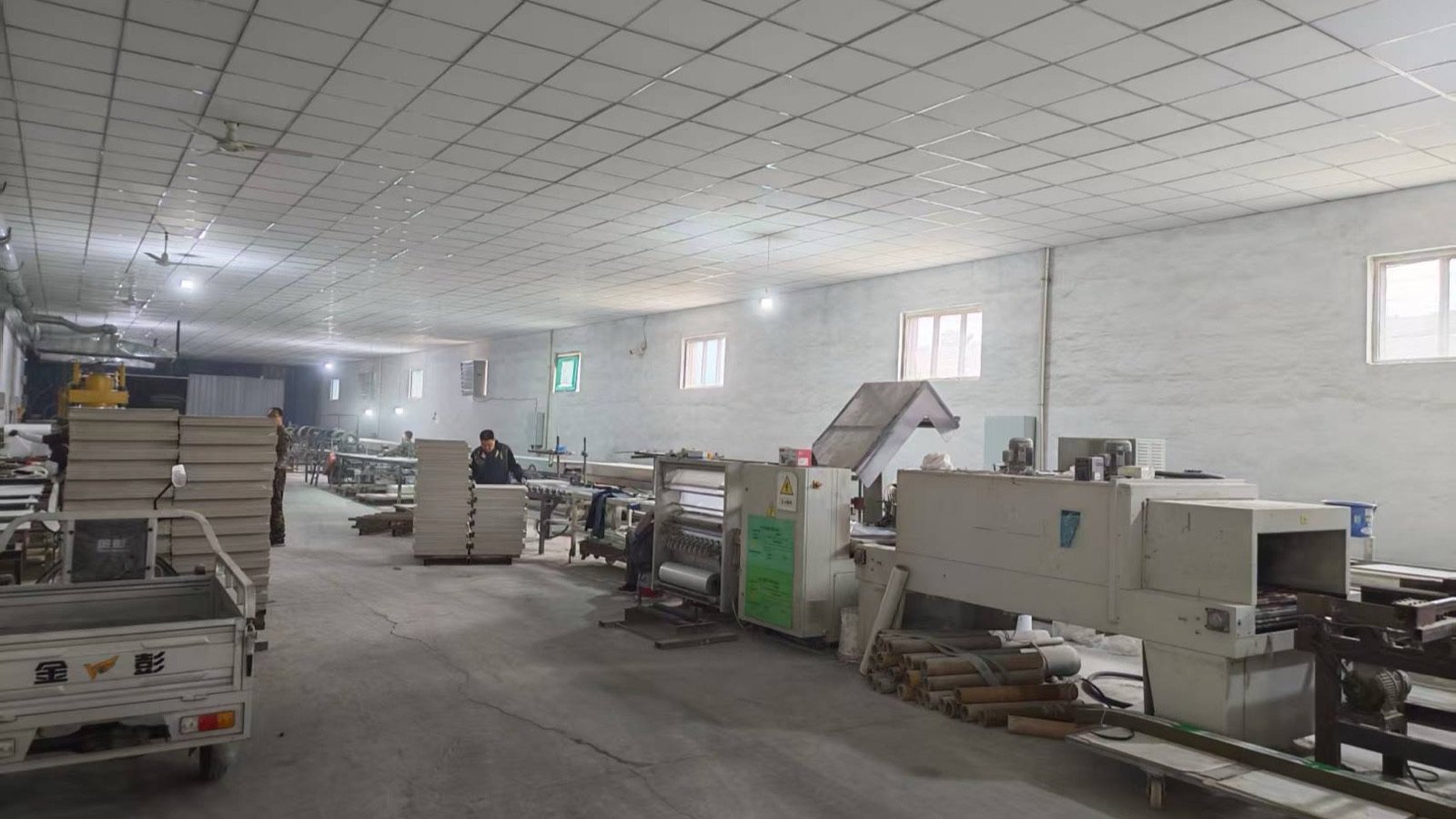Mineral fiber board production workshop with ceiling board processing line
