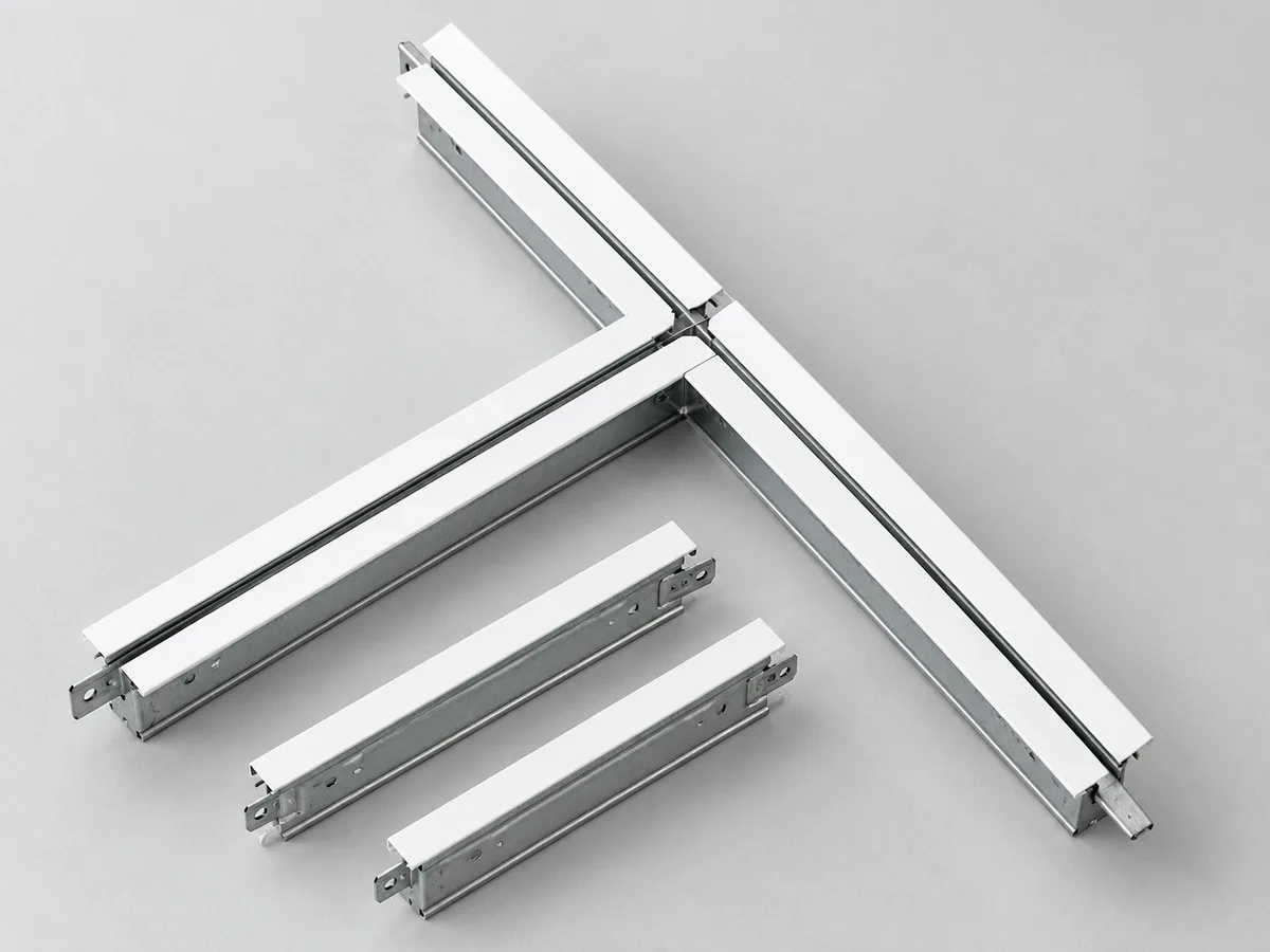 Illustrative product view: White-faced metal ceiling grid junction and suspension grid components